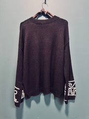 Maglia tuta nera con ricamo bianco