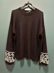 Maglia tuta nera con ricamo bianco